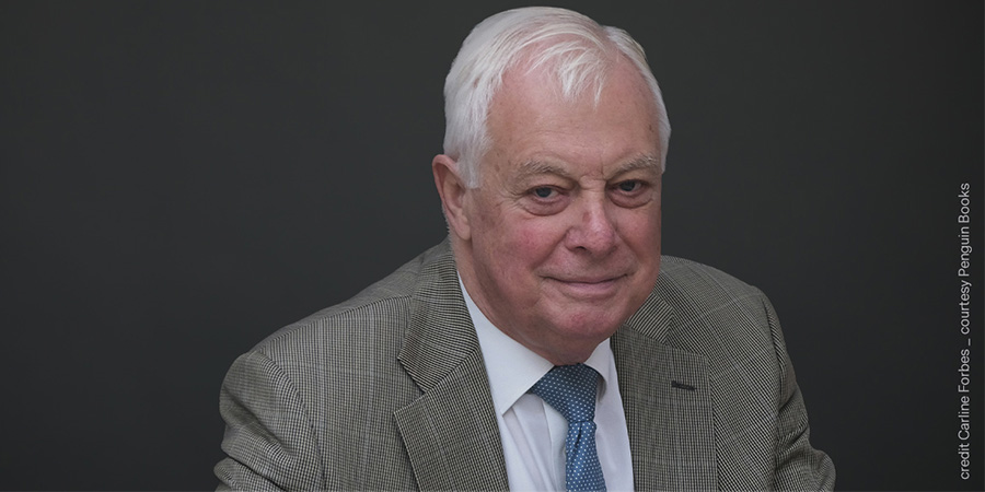 Lord Patten of Barnes, Member of the Vontobel Advisory Council in front of dark background